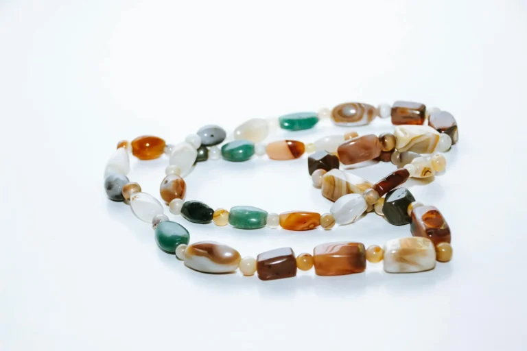 Close-up of a Baoshan Ice Purple necklace with colorful gemstones and intricate design