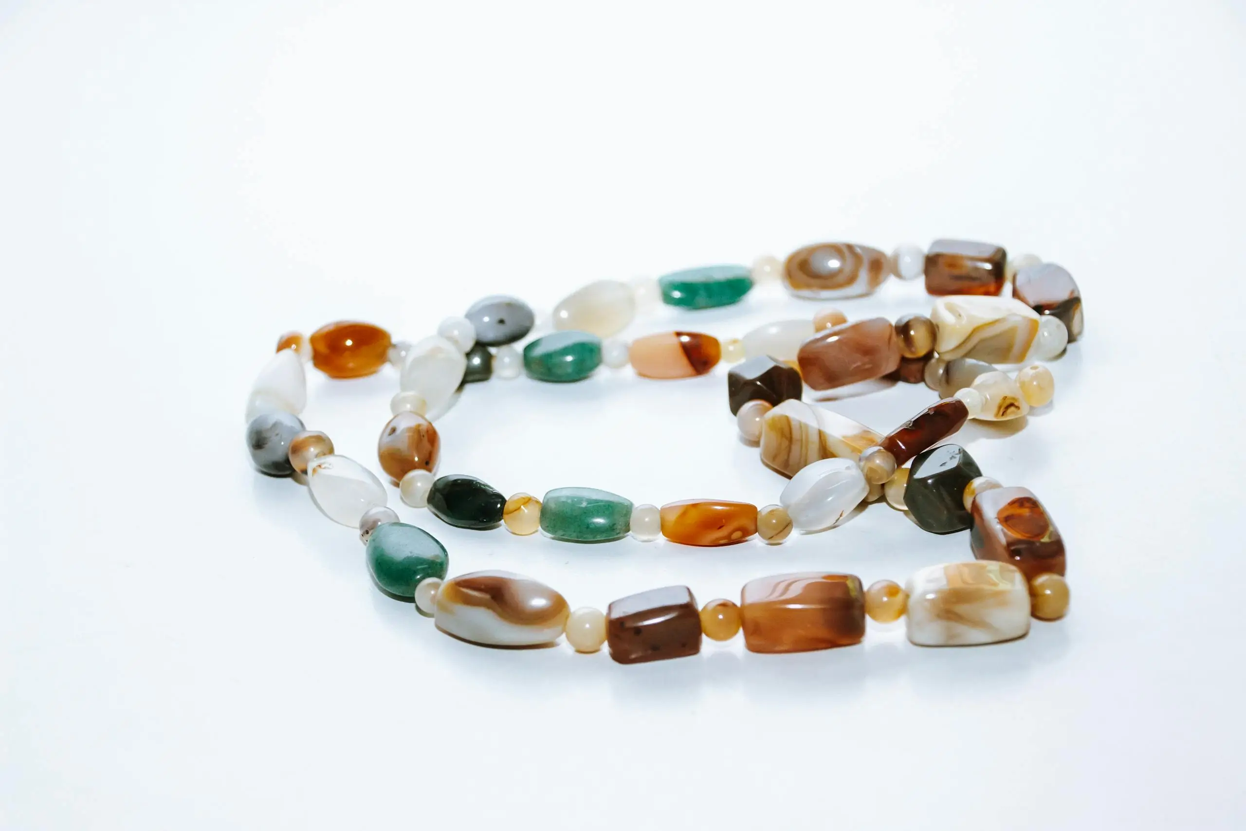 Close-up of a Baoshan Ice Purple necklace with colorful gemstones and intricate design