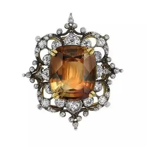 An elegant Victorian-era piece featuring a brown topaz stone set in silver, a classic and sophisticated example of jewelry from the period.