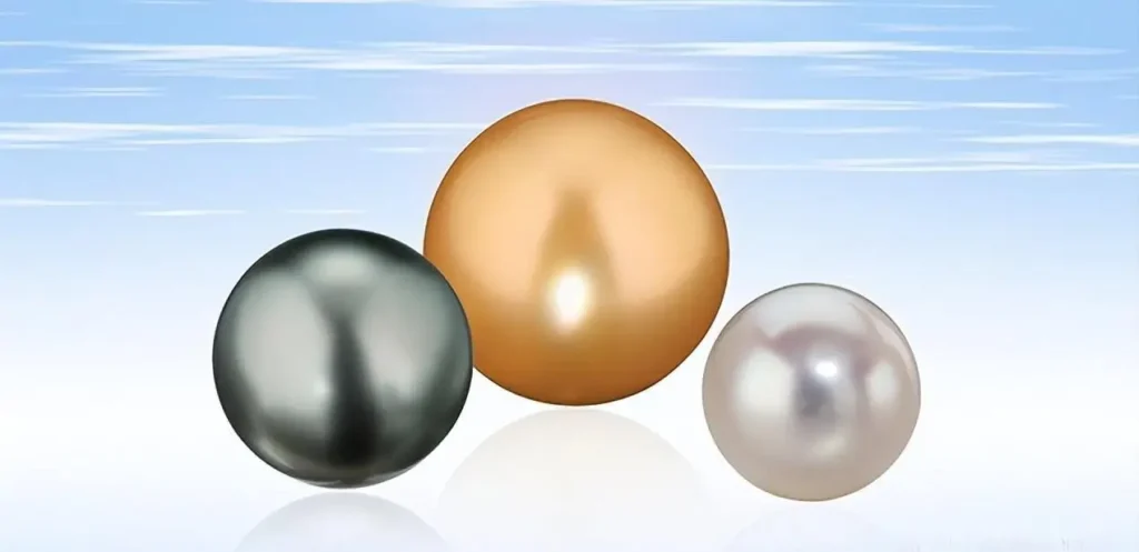 Australian White, South Sea Golden, and Tahitian Black pearls comparison showing their unique luster and color