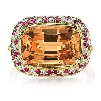 An exquisite yellow jade ring with a diamond halo, showcasing Topaz colors and value through its central stone and sparkling diamond accents.