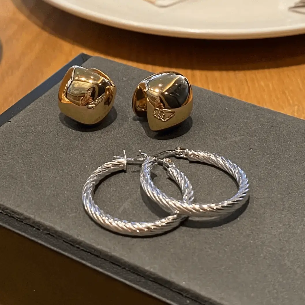 Classic, comfortable ear hoops with a timeless twisted design, perfect for any outfit.