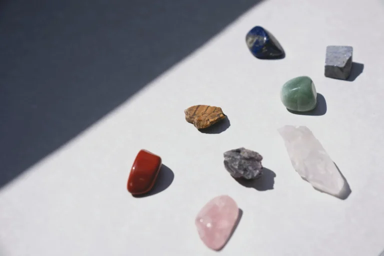 Colorful white healing crystals displayed, featuring opal, diamond, and quartz for spiritual energy.