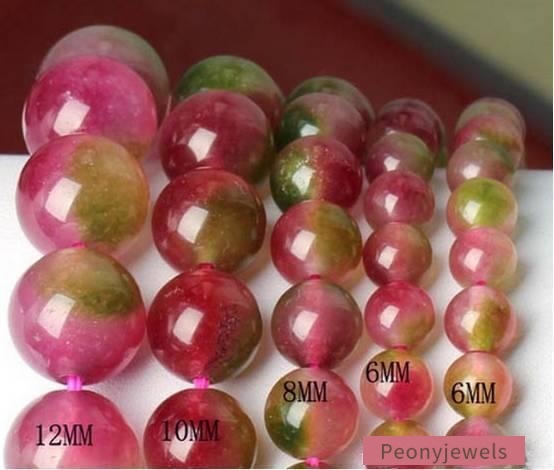 Close-up of dyed chalcedony and fluorite beads, clear in color but very soft with Mohs hardness of 4, prone to scratches and wear