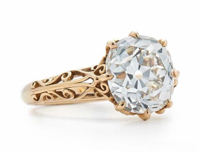 A ring featuring an eight-prong setting, with the gemstone securely held by eight prongs, providing enhanced stability and a striking, detailed design.
