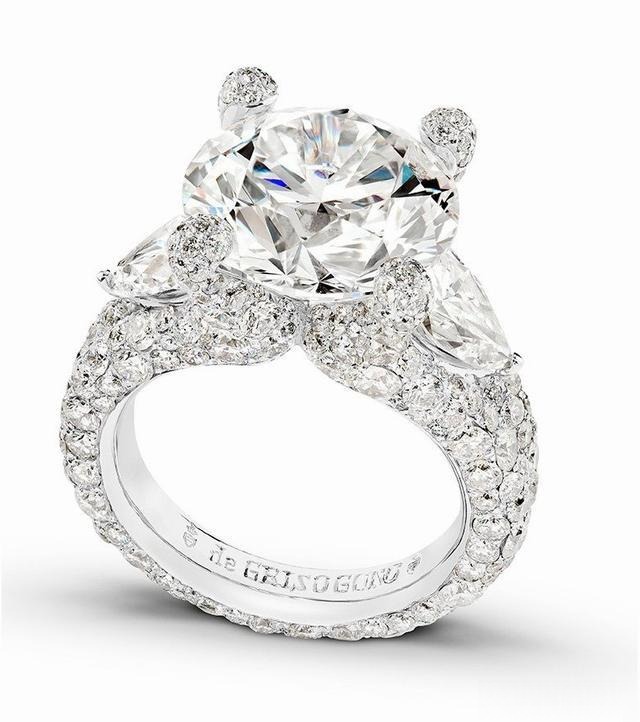 A ring featuring a classic four-prong setting, securely holding the gemstone with four prongs, offering a timeless and elegant design.