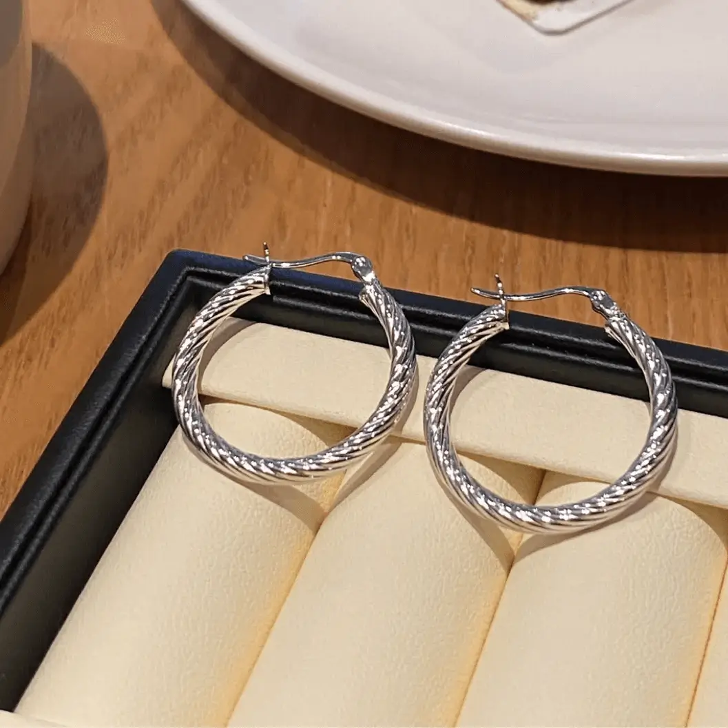 Hypoallergenic silver earrings, ideal for new piercings and sensitive ears.