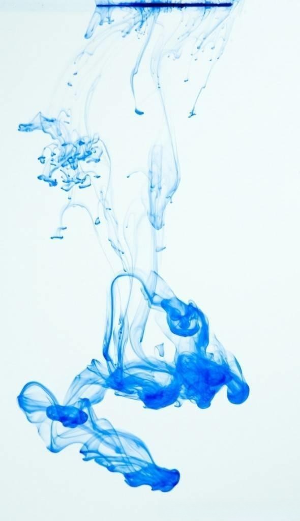 Ink diffusing in water, creating a "flowering" effect, similar to the spread of jadeite color foundation.