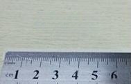 Unwrap the paper and measure the marked length in millimeters to find your ring size.
