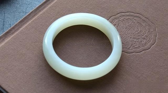 Custom Peonyjewels bangle made from aged Xinjiang Hetian jade seed material.