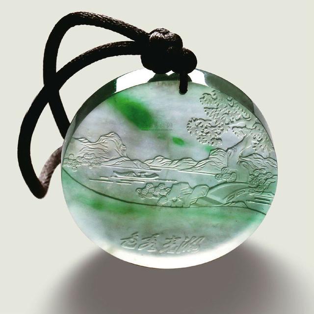 Round natural jadeite pendant, showcasing smooth texture and rich green color, perfect for jewelry lovers.