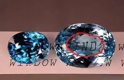 Two sapphires side by side; the left one shows normal light return, the right one has a circled area with windowing where light escapes.