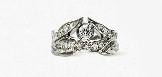 A ring where the stone seamlessly integrates into the band, creating a cohesive and unique design that enhances the overall elegance and flow.