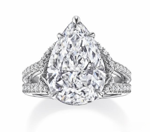 A diamond ring with a split band design, showcasing a unique, modern look where the band is divided into two parts for added elegance and style.