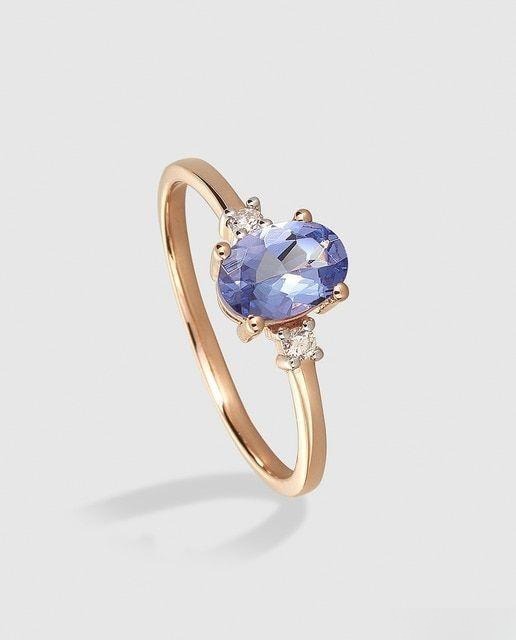 Gold ring featuring a vibrant Tanzanite gemstone with elegant design and fine craftsmanship