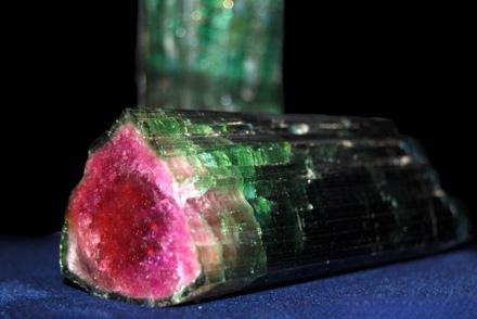 Colorful rough crystal showing vivid hues created by lithium, magnesium, iron, and sodium elements.