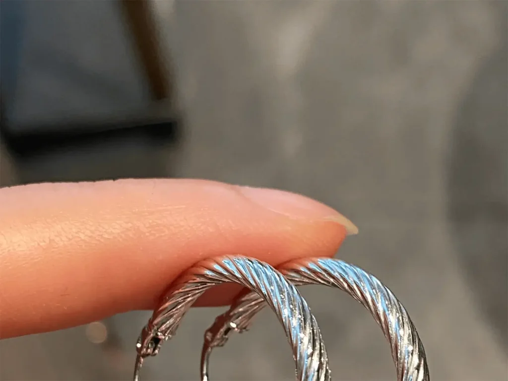 modern earrings featuring twisted line design for a stylish, intricate look.