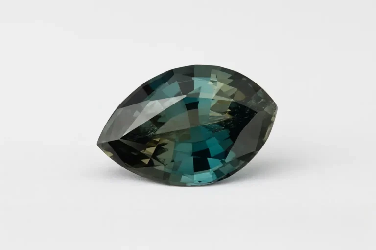 1.72 carat clean faceted Sapphirine gemstone showing bluish-green and pale yellow pleochroism.