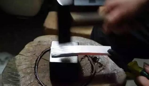 Artisan hammering gold and silver sheets using traditional Gu Fa Gold techniques, showcasing handcrafted metalworking and classic goldsmith skills