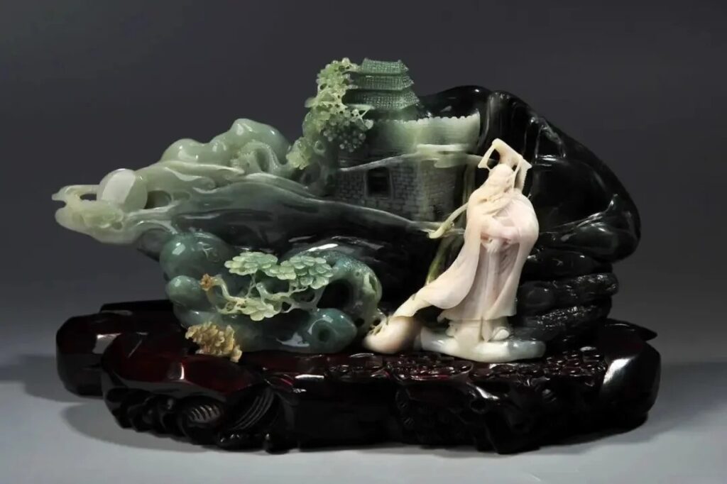 A carved ornament made from Bluish-Gray Dushan Jade (Qing Du Yu), showcasing its common blue, grayish-blue, and light bluish-gray tones.