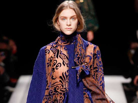 Decorative pin styled with a scarf, instantly elevating your outfit and adding chic flair, perfect for snowy winter days.