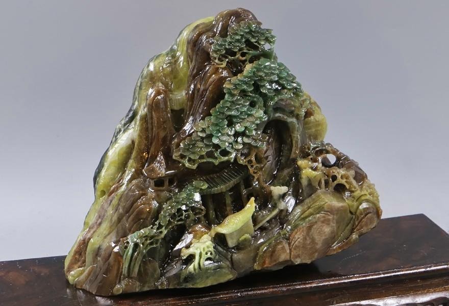 Jade ornament displaying typical brown hues (He Du Yu), ranging from dark brown to grayish-brown and yellow-brown.