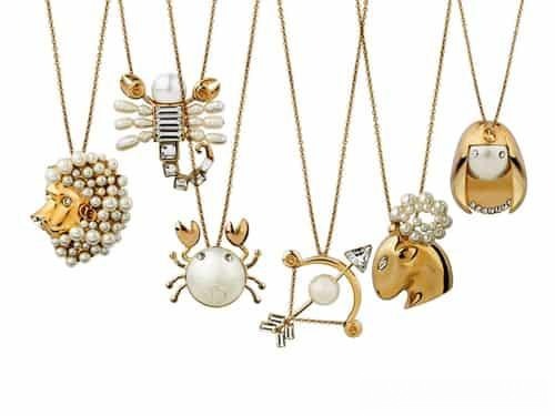 Dior Tell Me zodiac necklace collection featuring crystal and pearl designs representing all twelve zodiac signs