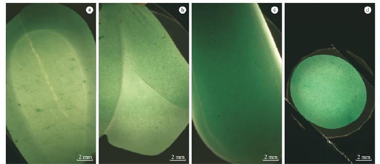 Green Quartzite  White Base with Aventurescence - Magnified view of the quartzite granular structure, with directional green inclusions and yellow pyrite inclusions creating aventurescence.
