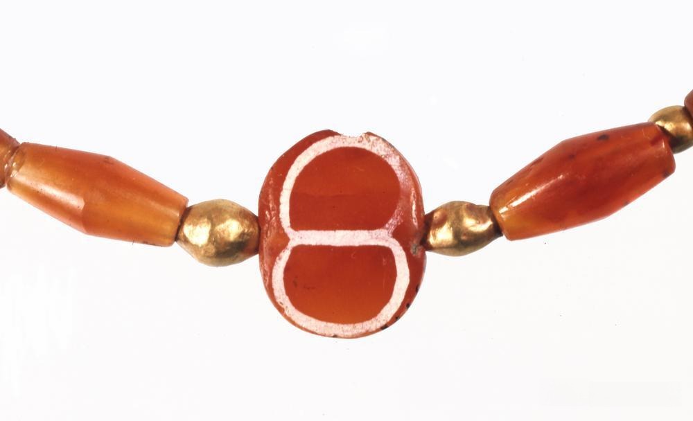 Close-up of an etched bead necklace, with patterns closely linked to social status and religious rituals in the Harappan civilization.