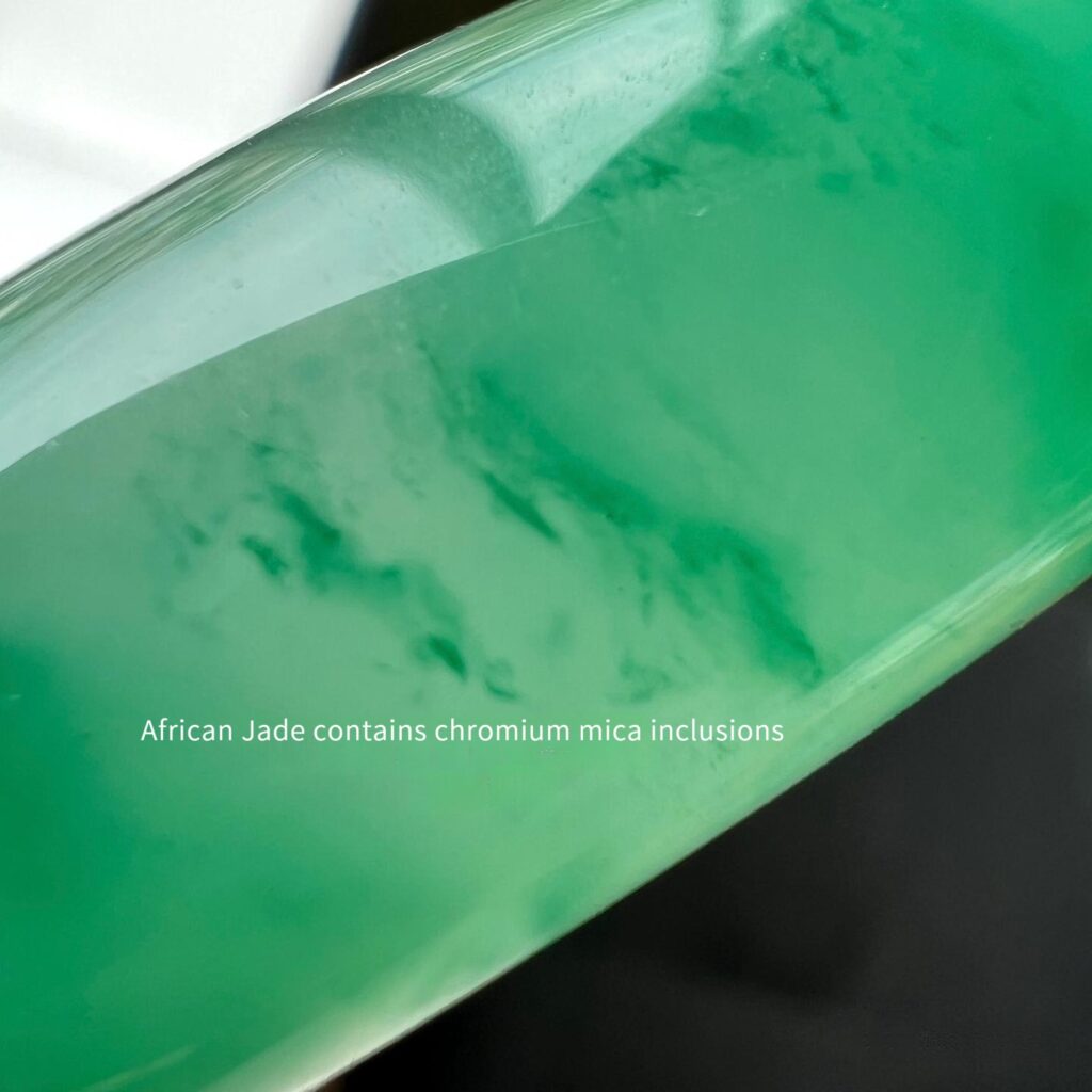 Close-up of a green quartzite bangle showing chromium-rich mica inclusions and natural floating patterns.