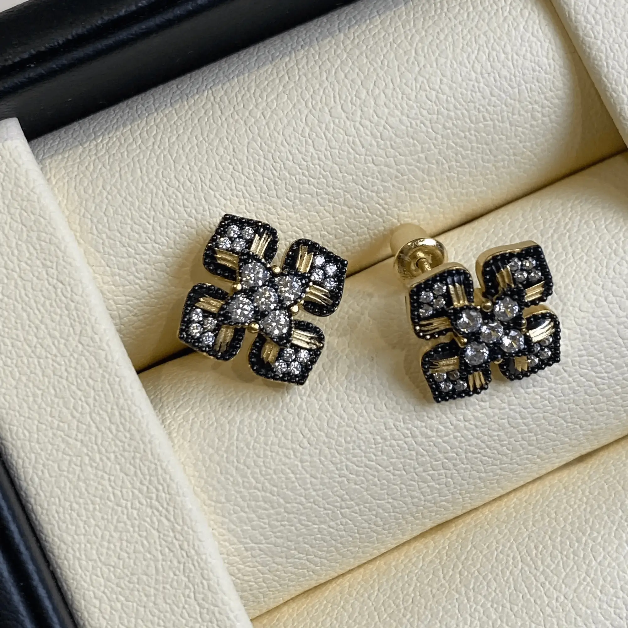 Handcrafted earrings with zircon and black beaded edges for elegant formal occasions.