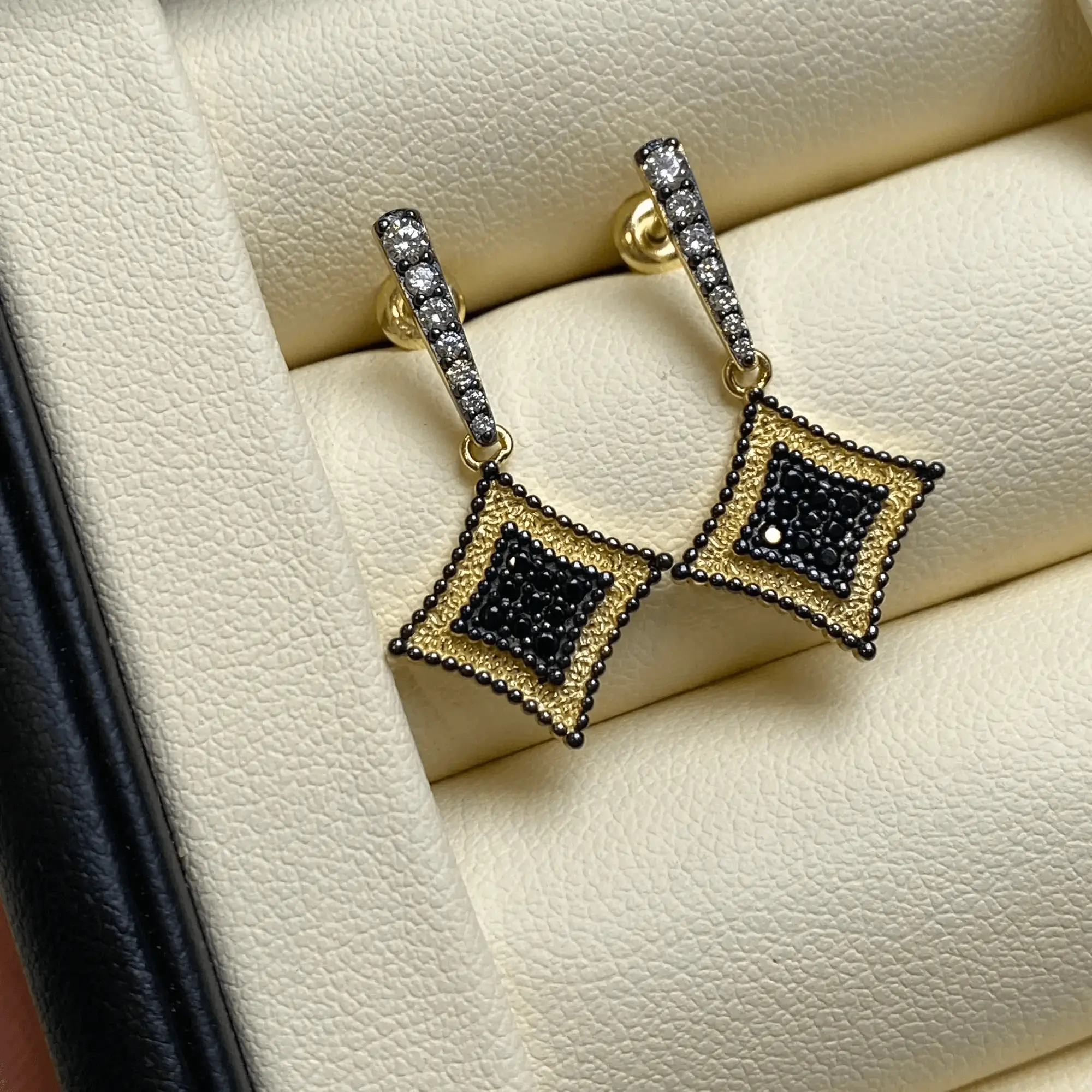 Handcrafted sterling silver earrings with cubic zirconia, perfect for office elegance.