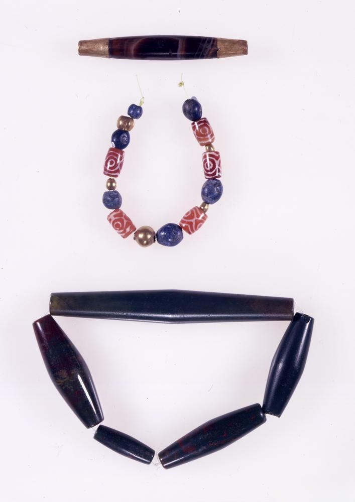Lapis lazuli jewelry paired with etched beads, reflecting the Sumerians' deep fascination with lapis lazuli.