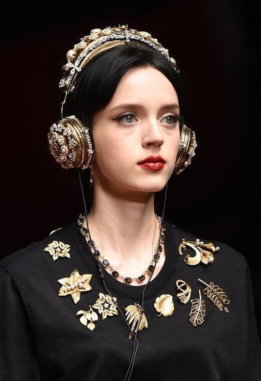 Model wearing brooches wrapped around the chest, showcasing how to create your own custom brooch necklace design.