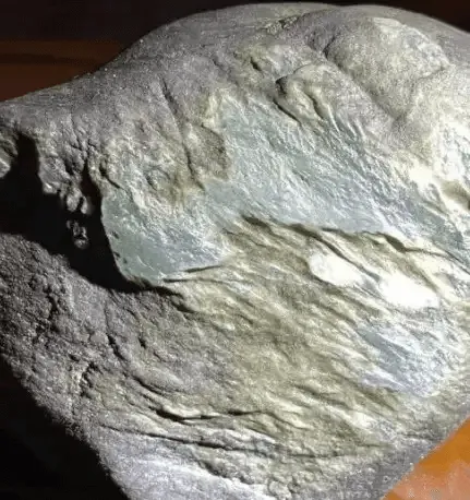 Old jadeite stone from an ancient mining area or pit, known for its finer texture and high-quality material – Jadeite Buying Guide