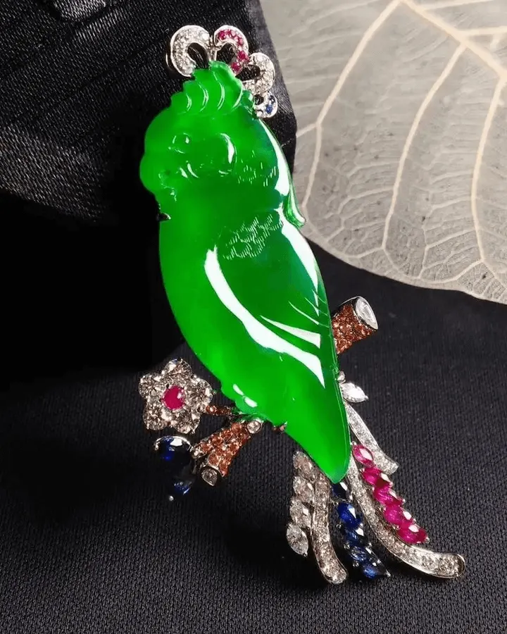 Bird-shaped jadeite brooch in vivid high-quality green color, showcasing premium jadeite - Jadeite Buying Guide.