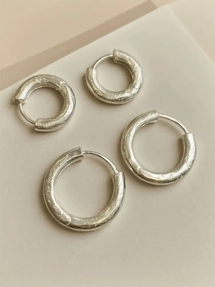 Peonyjewels handcrafted sterling silver hoop earrings created using the traditional lost-wax casting technique.