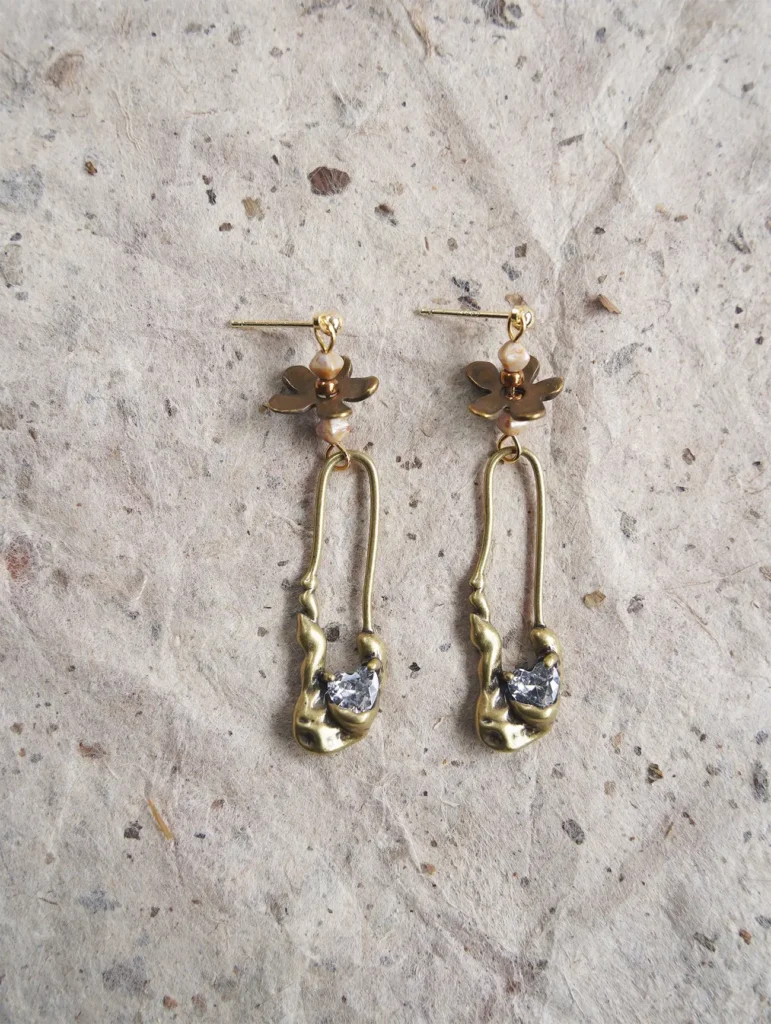 Handmade vintage earrings styled on a model, suitable for office or professional settings.