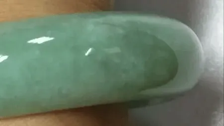 Peonyjewels jadeite bangle with visible Cui Xing flywing texture, typical of coarse-grained jadeite