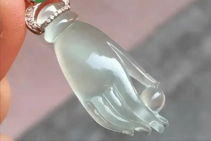 Gel-like jadeite Buddha hand pendant from Peonyjewels with smooth, translucent, jelly-like appearance