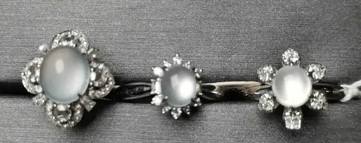 High-quality jadeite ring from Peonyjewels showing glossy halo effect on polished curved surface
