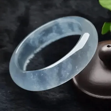 Peonyjewels snowflake Mian jadeite bangle showing white cotton-like inclusions, natural internal crystal features – Jadeite Buying Guide
