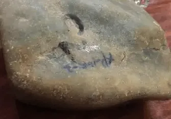 Jadeite rough with smooth water-polished skin, fine and silky to touch, showing no sandy texture.