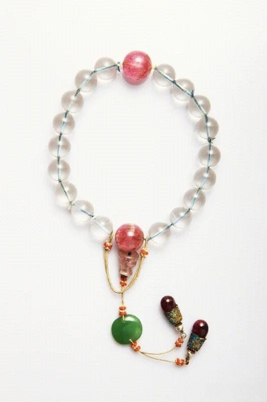 An ancient Chinese crystal artifact: a Qing Dynasty eighteen-bead crystal bracelet, showcasing exquisite craftsmanship with transparent beads and elegant design.