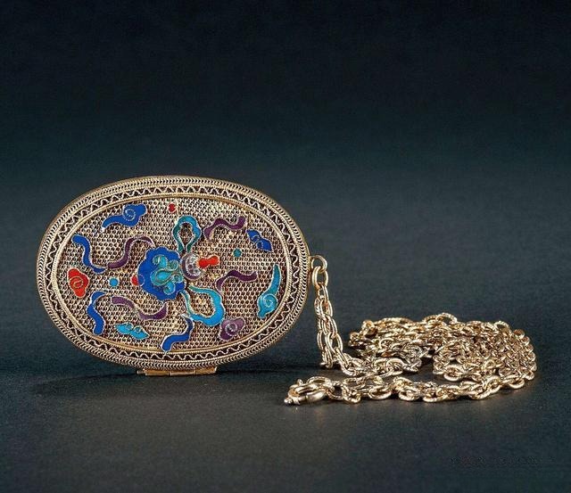 Qing Dynasty silver filigree sachet with enamel decoration, showcasing intricate traditional craftsmanship