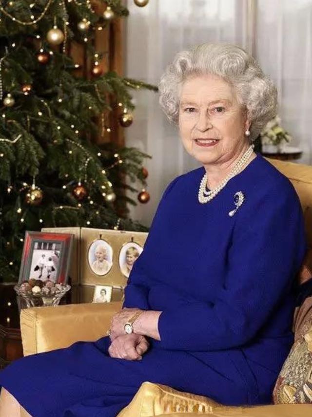 Queen Elizabeth II wearing a royal blue outfit, highlighting the deep, elegant blue favored by the British monarchy.