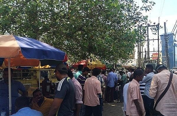A view of the Gem Street in Ratnapura, Sri Lanka, showing the downtown area near the clock tower where cut stones and rough material are traded in the afternoon.
