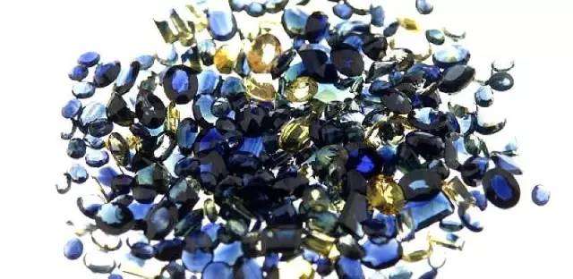 Chinese Shandong Gemstones: Small, rough, dark blue to black Chang Le Sapphires from Shandong before heat treatment.
