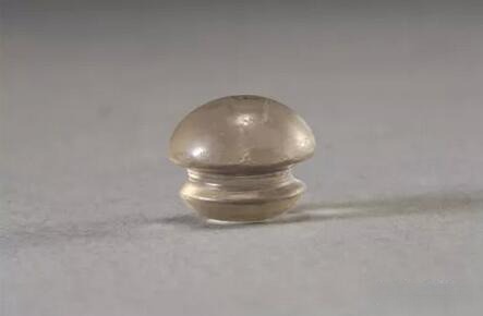 A single crystal ear pendant unearthed from the Liangzhu Ruins in Zhejiang, dating back over 5,000 years, still shimmers as if newly made.