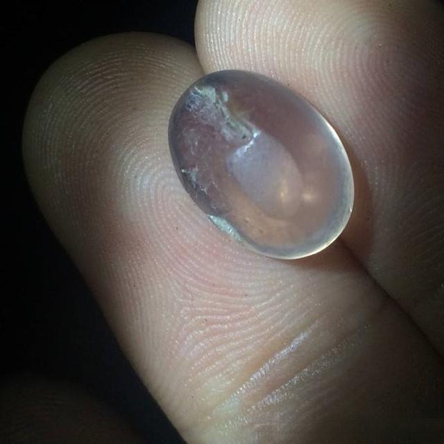 Star rose quartz gemstone with rough and uneven base, showcasing its natural formation